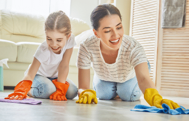 mother and daughter cleaning together