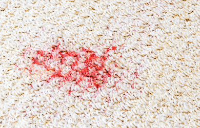 Red spot on light colored carpet