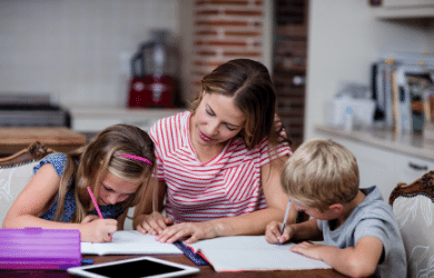 mother helping children with homework