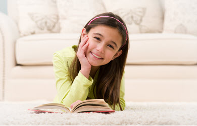 green carpet cleaning, girl on clean carpet reading a book