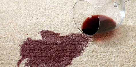 Red wine stain on white carpet