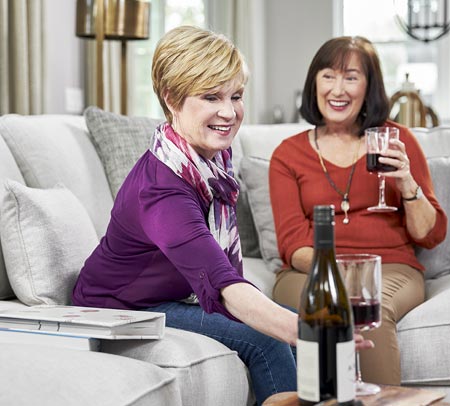 two women drinking wine