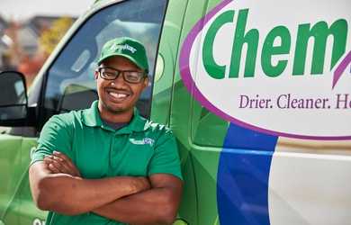 Chem-Dry technician stands by commercial carpet cleaning van