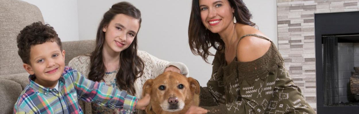 Mother with 2 children and a dog