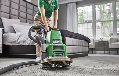 Chem-Dry technician using a carpet cleaner