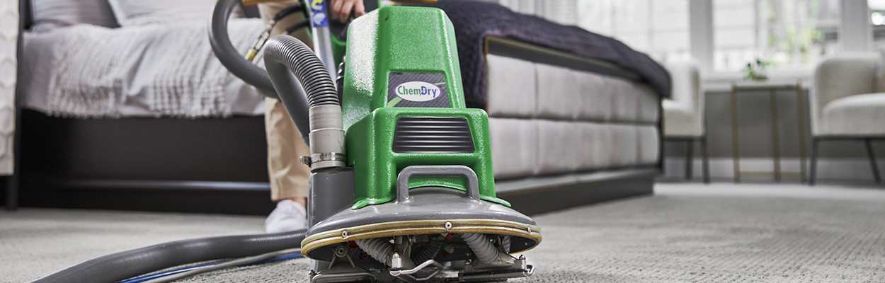 Chem-Dry technician using a carpet cleaner