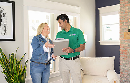 Chem-Dry technician standing with smiling client