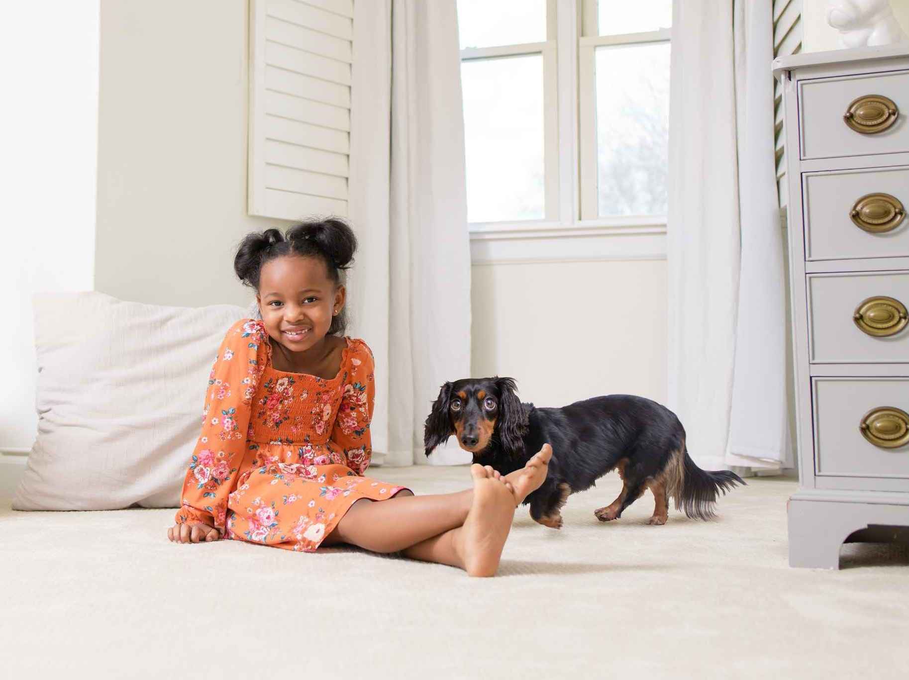 Girl sitting with dog