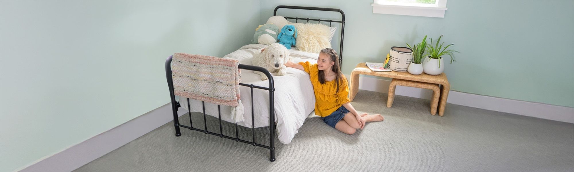 Girl sitting next to dog