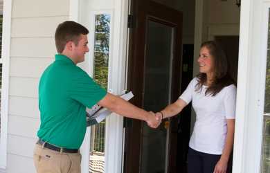 Chem-Dry carpet cleaners greets homeowner at door