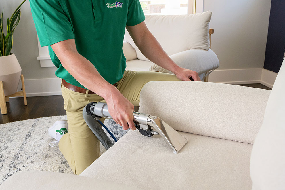 technician cleaning upholstery
