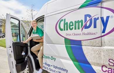 Chem-Dry carpet cleaning company van with technician