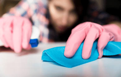 woman wiping a surface clean