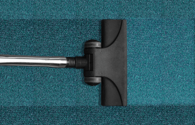 vacuum cleaner on blue carpet