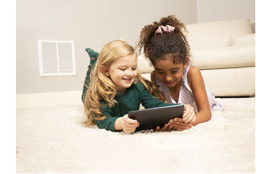 carpet cleaning two girls look at tablet