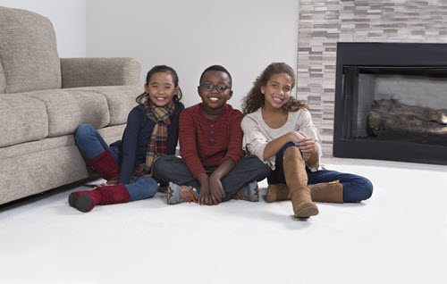 kids sitting on clean carpet after affordable carpet cleaning from Chem-Dry