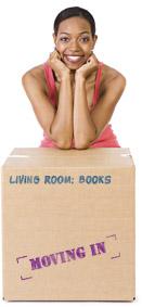 Woman leaning on moving boxes
