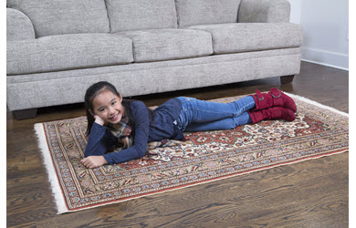 rug cleaning, girl lies on clean rug